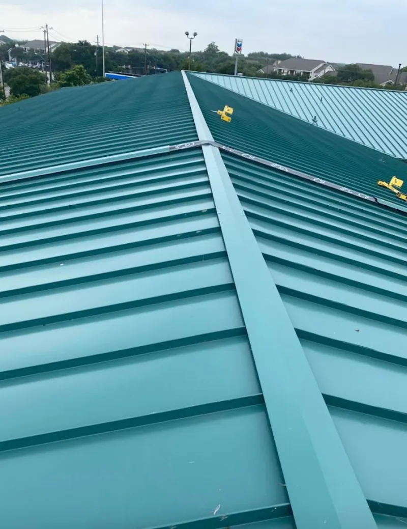 Green commercial metal roof ridge and valley for Metal Roof Repair in Vernon
